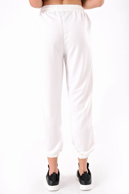 The white printed tracksuit is taken