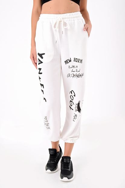 The white printed tracksuit is taken