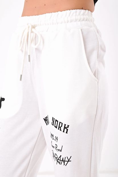 The white printed tracksuit is taken