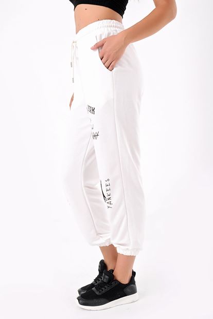 The white printed tracksuit is taken