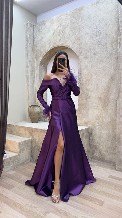 Plum colored boat neck evening dress with feather detail on the sleeves 