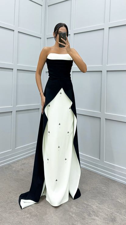 فستان سهرة أسود بتصميم غير متماثل