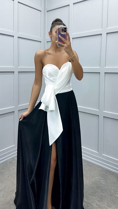 فستان سهرة أبيض بدون حمالات مزين بفيونكة عند الخصر