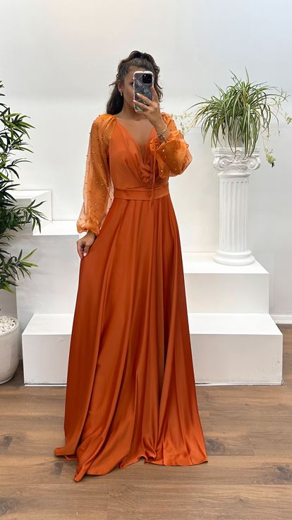 Vestido de noche con escote en V y mangas abullonadas color azulejo