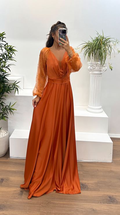 Vestido de noche con escote en V y mangas abullonadas color azulejo