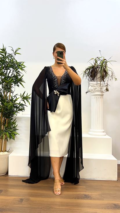 Abito da sera taglie forti con dettaglio manica longuette in osso nero