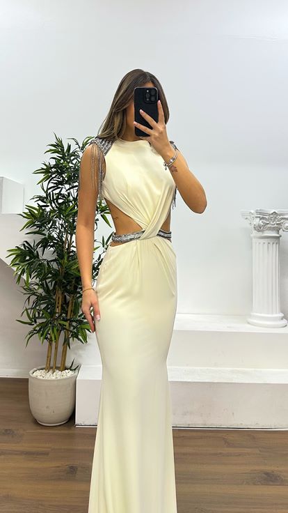 Off white evening dress with shoulder and waist detail 