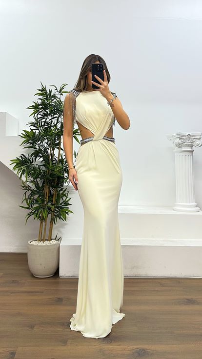 Off white evening dress with shoulder and waist detail 