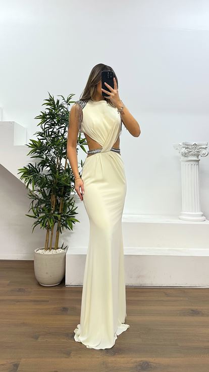 Off white evening dress with shoulder and waist detail 