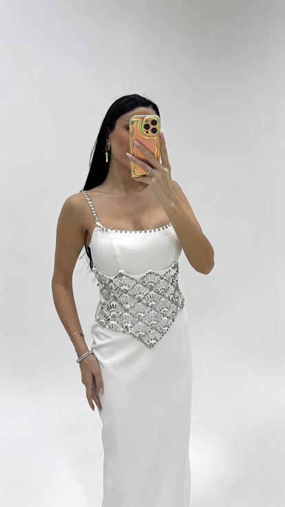 Bone strapped evening dress with crystal embellishments at the waist 