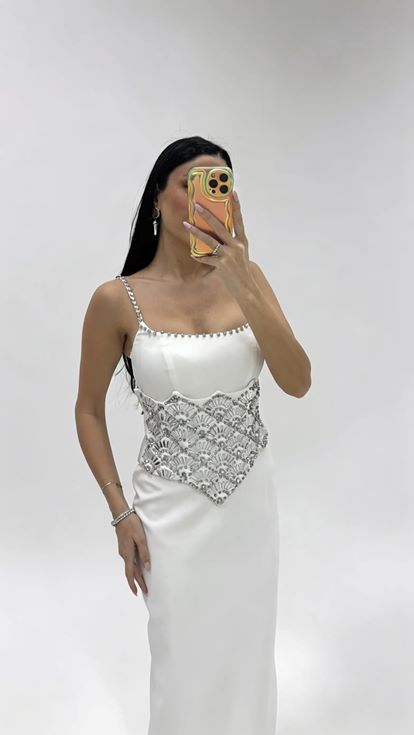 Bone strapped evening dress with crystal embellishments at the waist 
