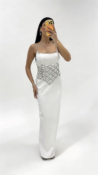 Bone strapped evening dress with crystal embellishments at the waist 