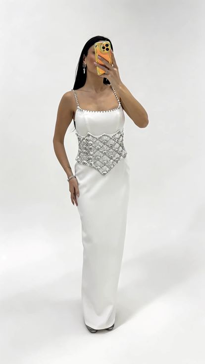 Bone strapped evening dress with crystal embellishments at the waist 