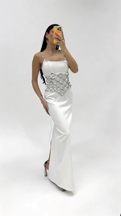 Bone strapped evening dress with crystal embellishments at the waist 